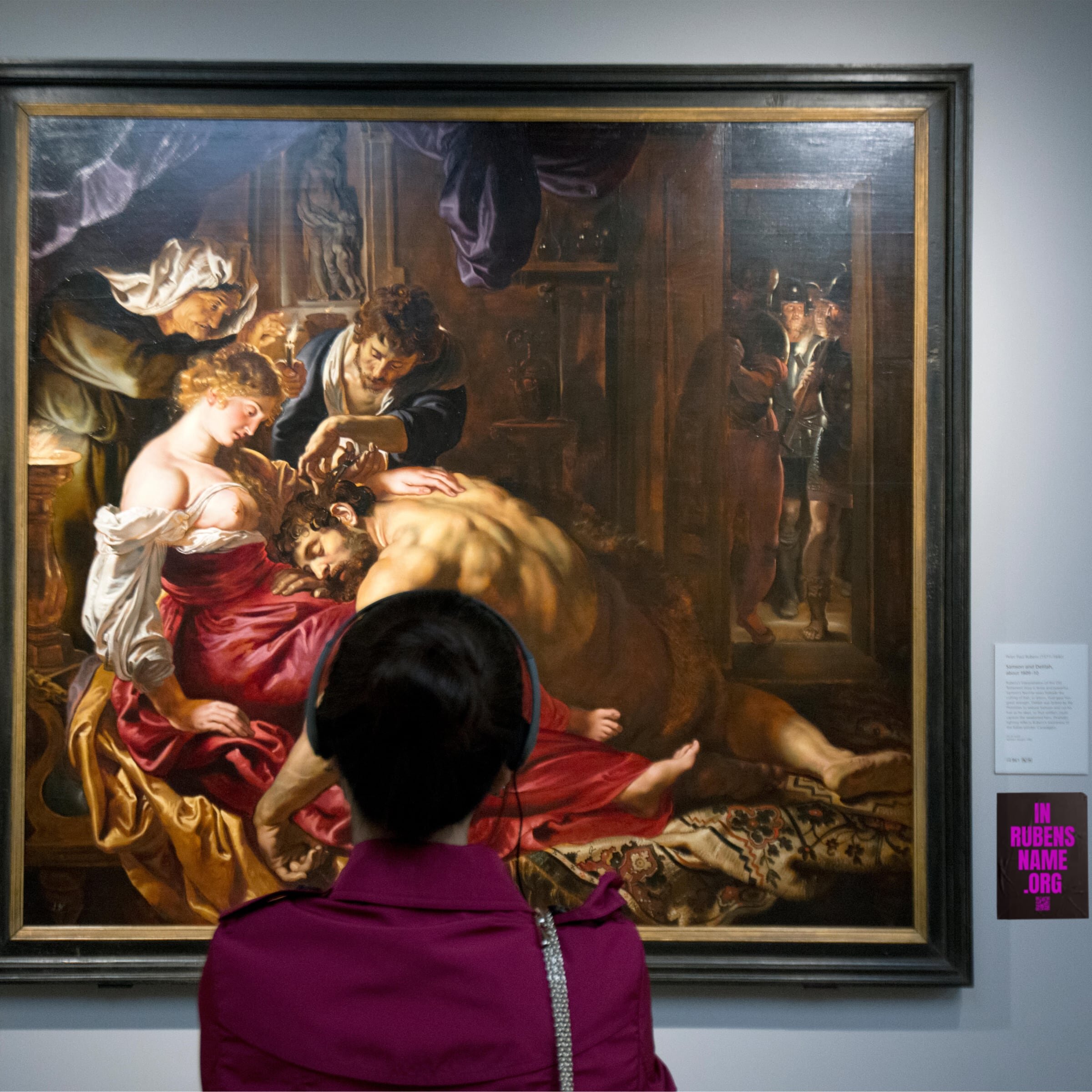 Visitors looking at the ‘Samson and Delilah’ in the National Gallery, London